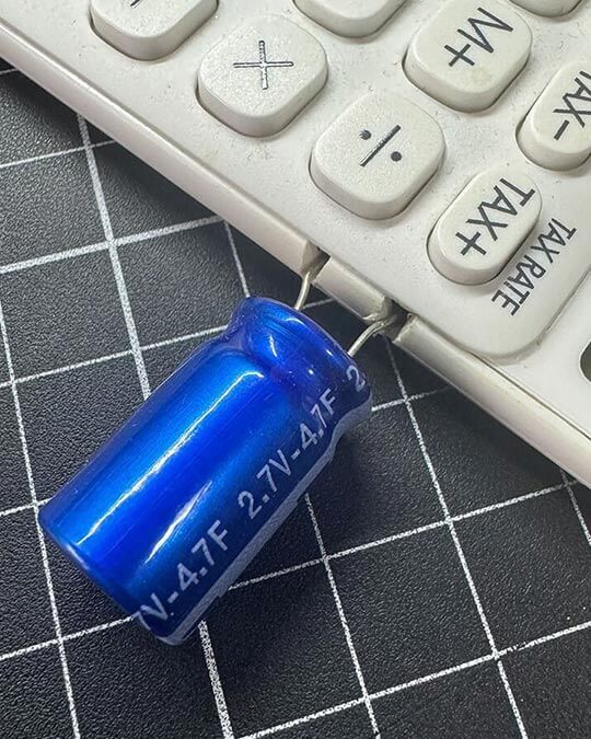 Close-up of 4.7F supercapacitor on calculator